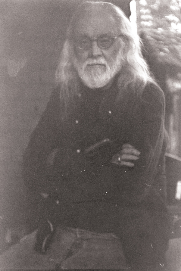 An image of Mr. Brandt and an image of a tree trunk.
