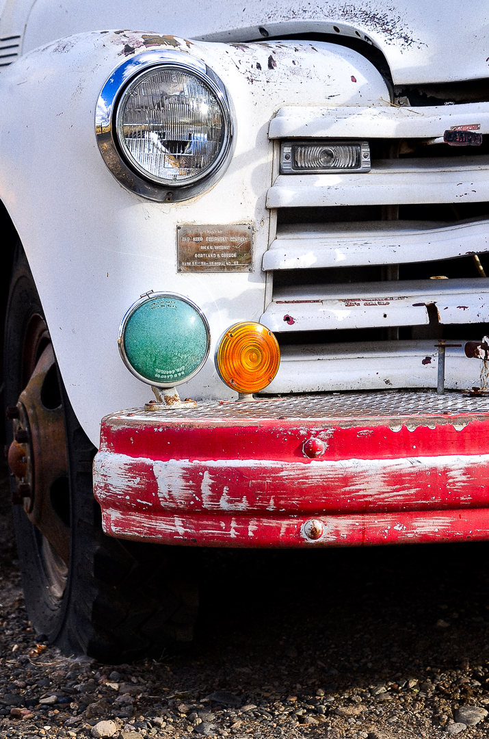 An image of a detail of the front grill of an old fire truck.